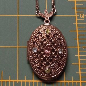 Locket on a silver colored chain 1928 necklace